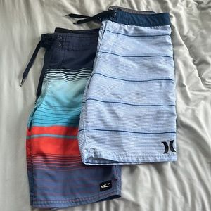 Two pairs of Boys surf shorts. O’Neill, Hurley. Size 27.  Bathing suit.